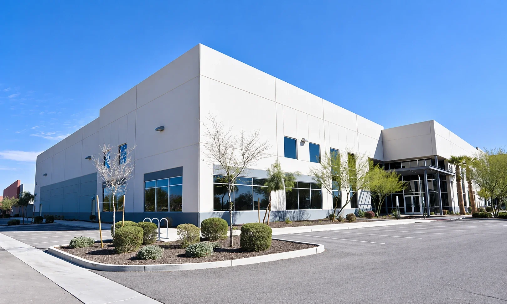 Factory exterior with landscaped entrance